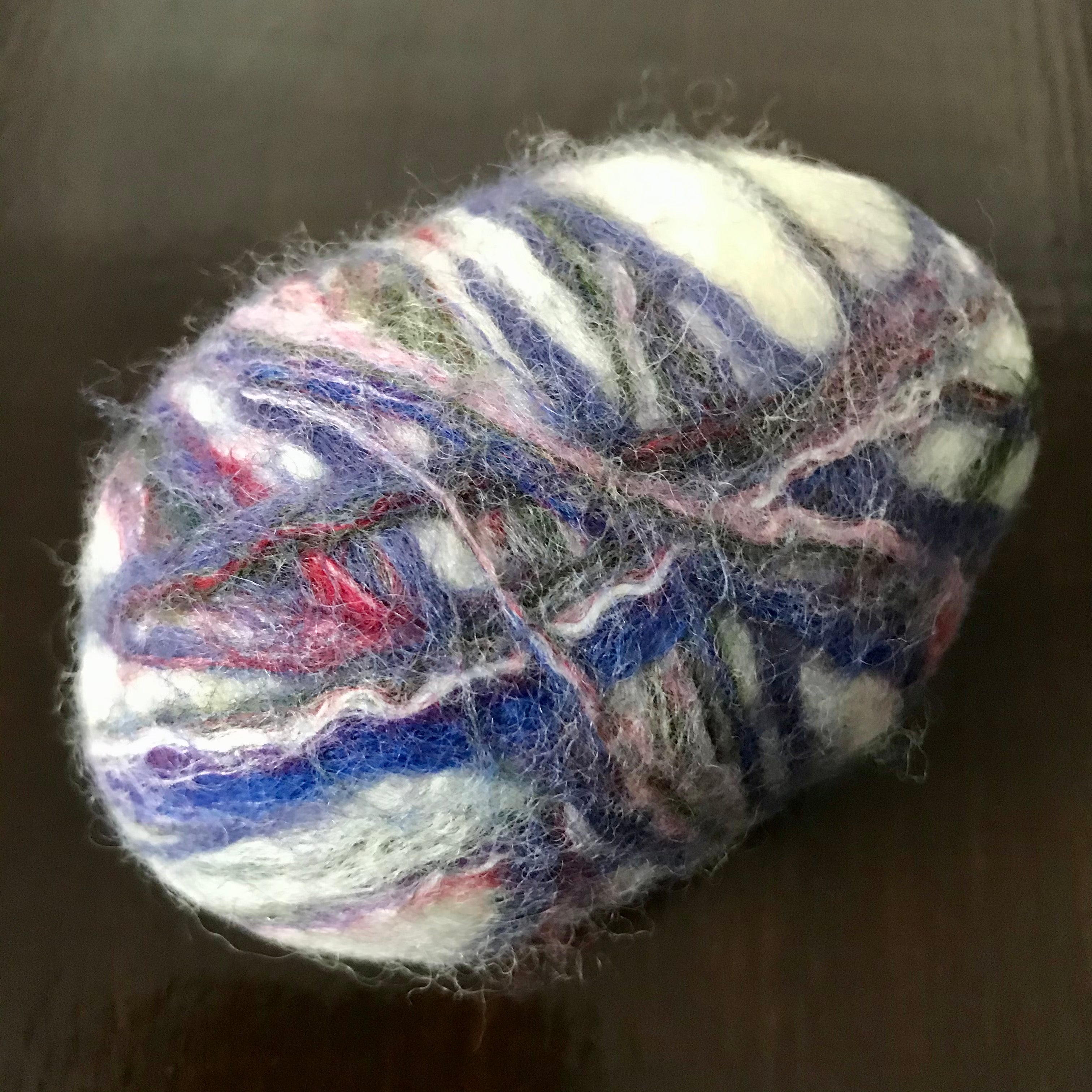 Close-up of the felted lavender oval soap’s textured surface highlighting handcrafted fiber details and vibrant purple hues.