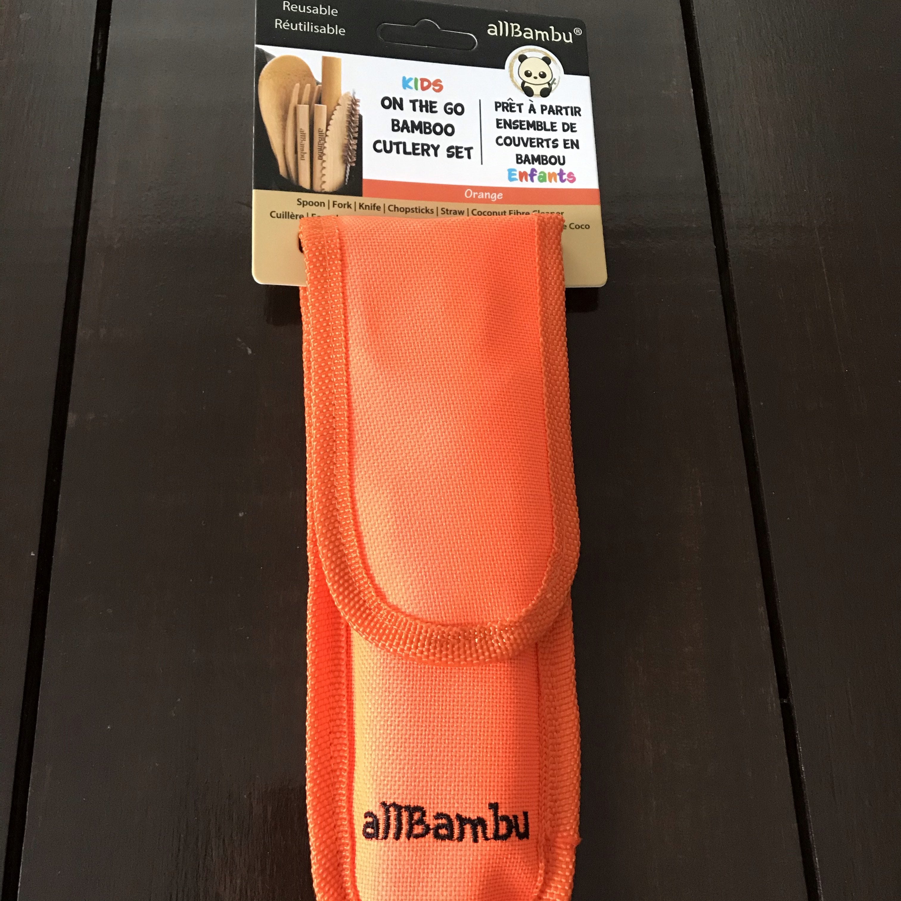 Close-up of bamboo utensil handles showcasing smooth finish and natural grain details in a clean, organized travel cutlery