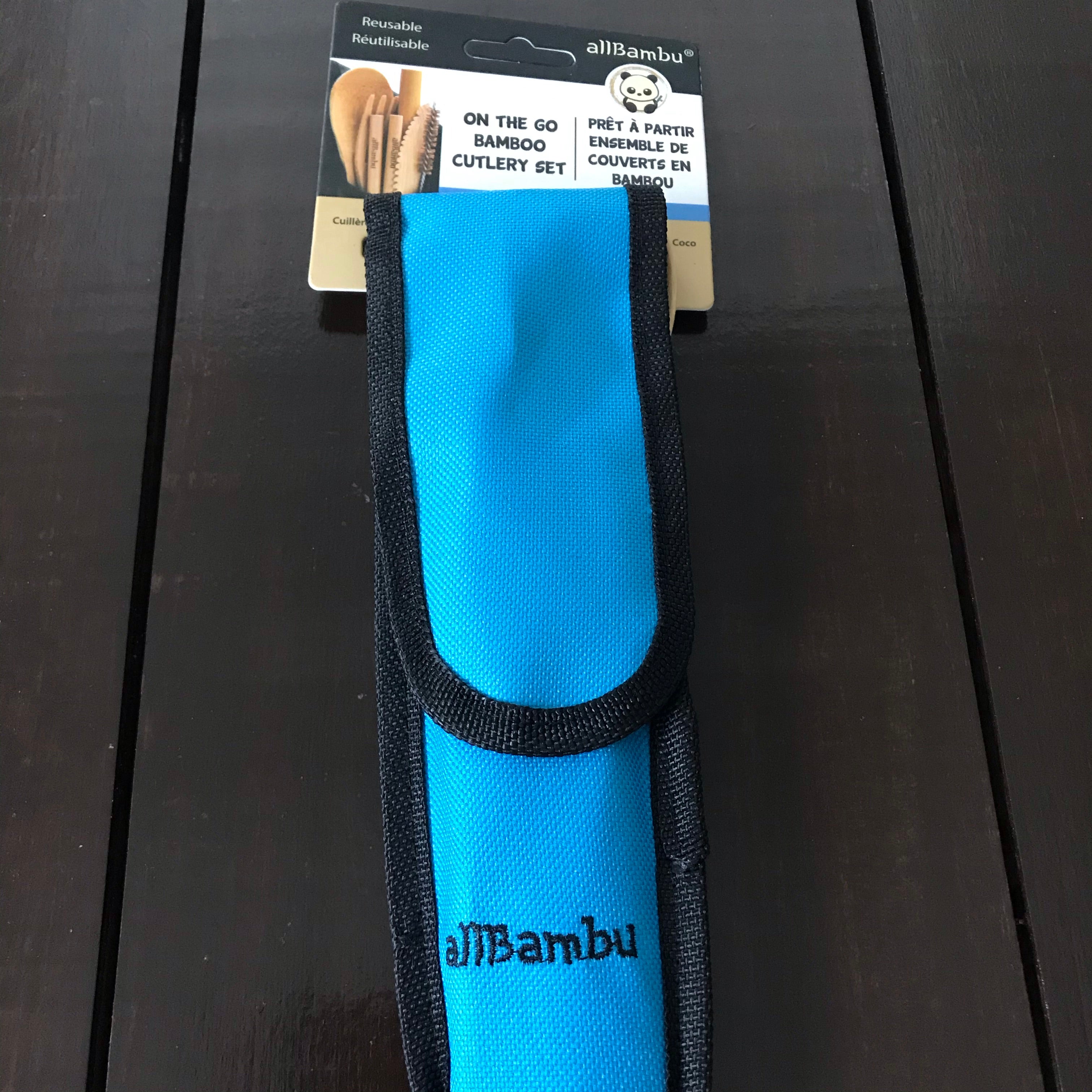 Close-up of bamboo handles and stainless-steel tips on the travel cutlery, highlighting eco-friendly material and smooth