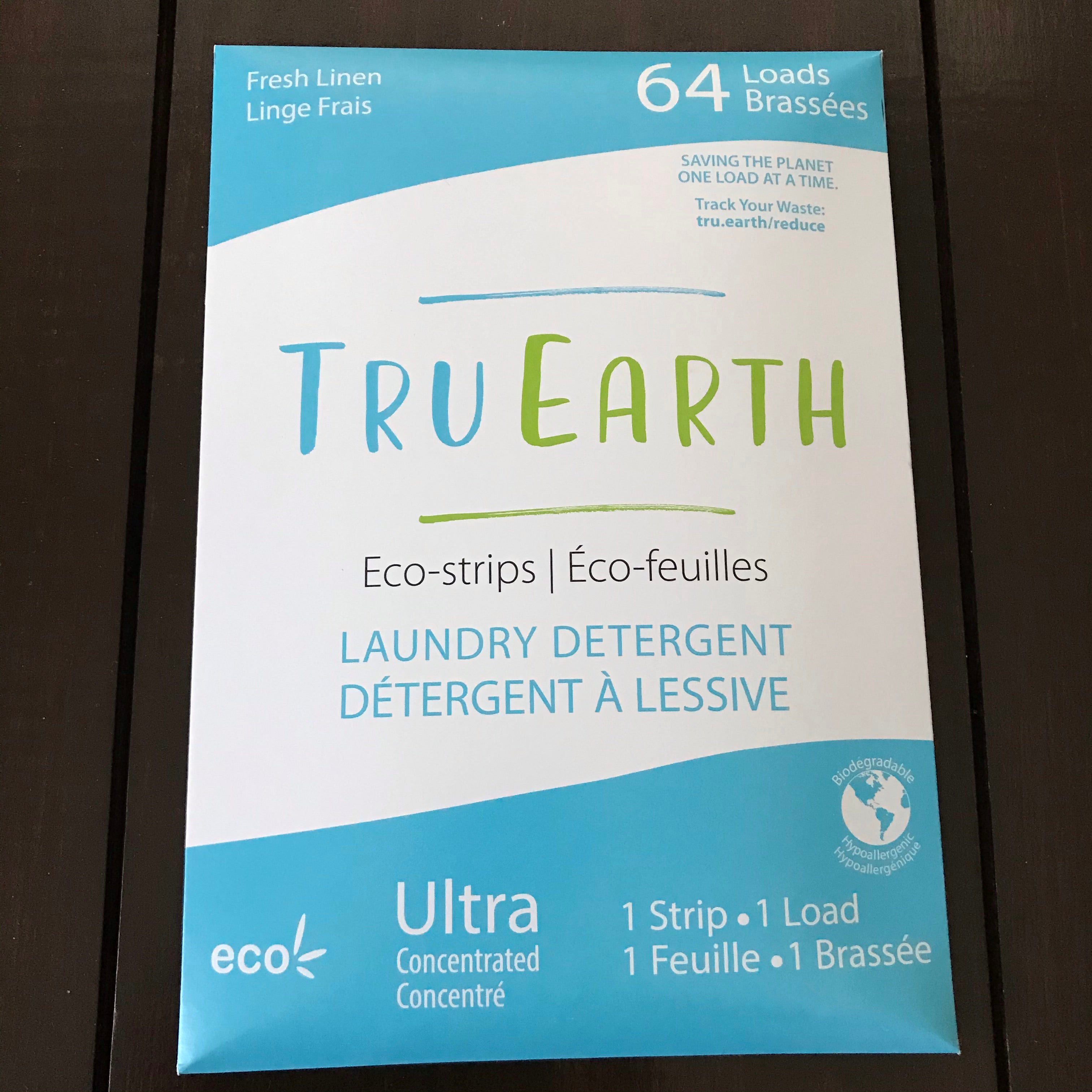 Close-up of Tru Earth Eco Strips laundry detergent package showing textured surface and vibrant label design