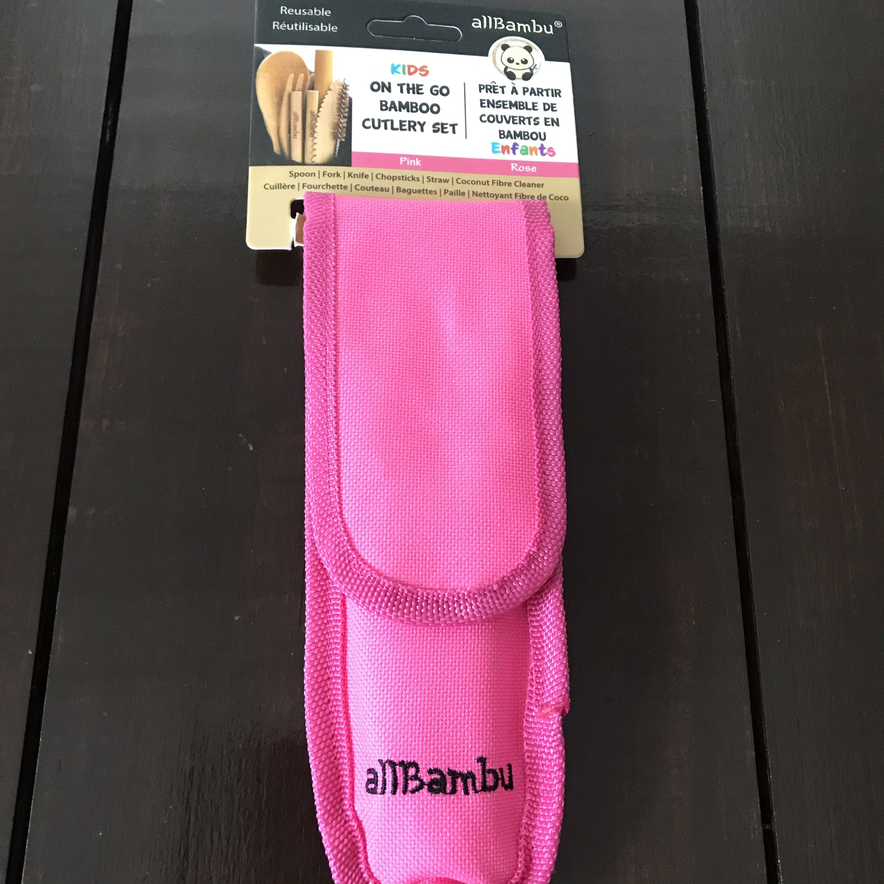 Close-up of bamboo utensils with engraved logo and smooth finish, showing detailed grain texture and eco-friendly