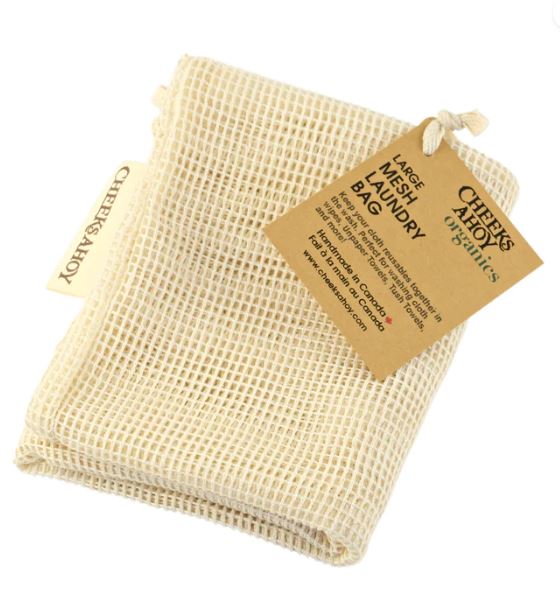 Close-up of the Cheeks Ahoy laundry bag’s reinforced stitching and textured nylon fabric in vibrant coral color.