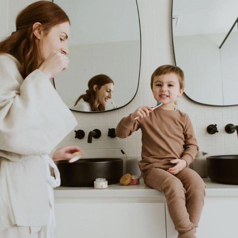 Close-up of the TANITABS Strawberry Toothpaste Tablets displaying the round, light pink tablets with detailed labeling on a