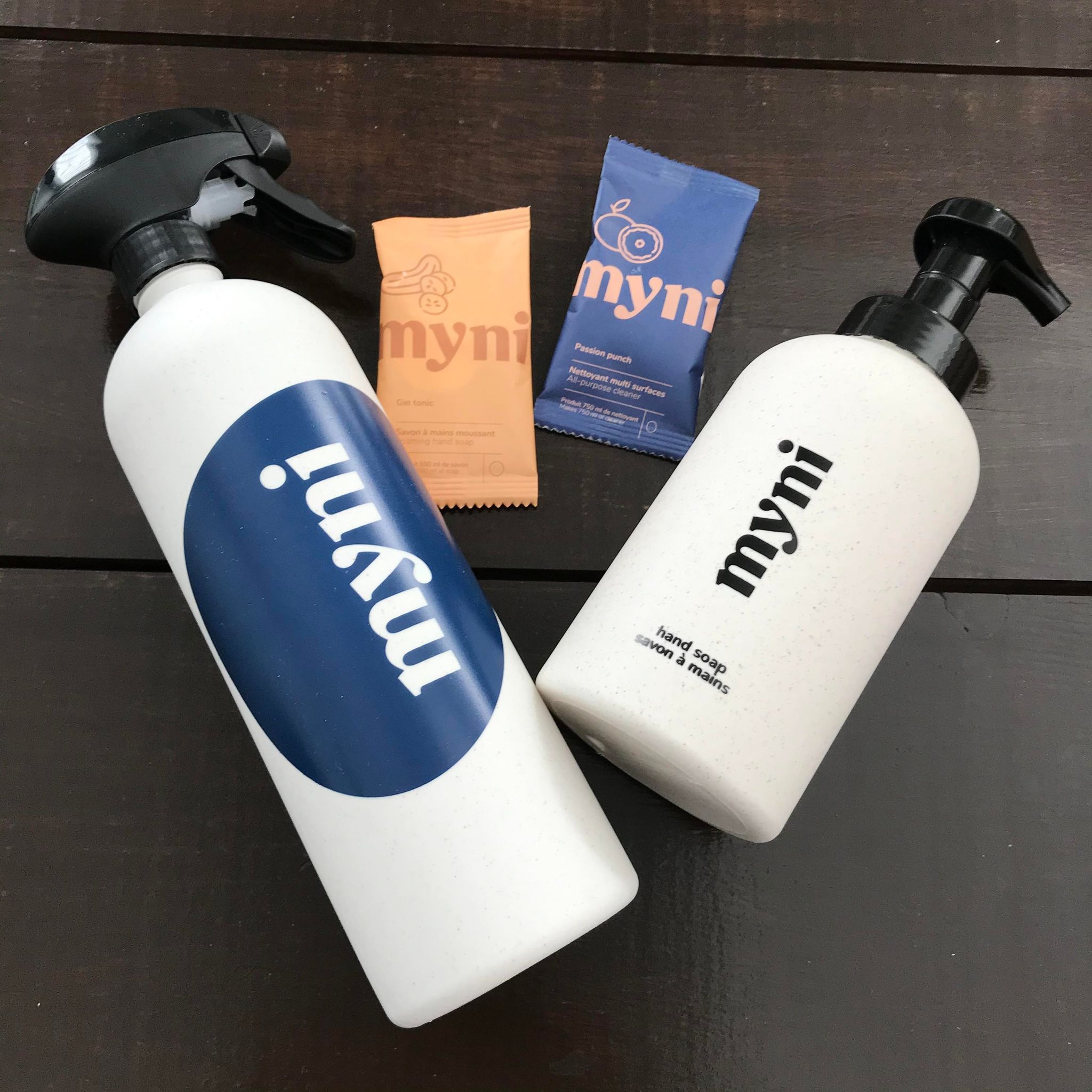 Myni Starter Kit with biodegradable cleaning concentrate tablets, frothing hand soap, and reusable bottle, made in Canada