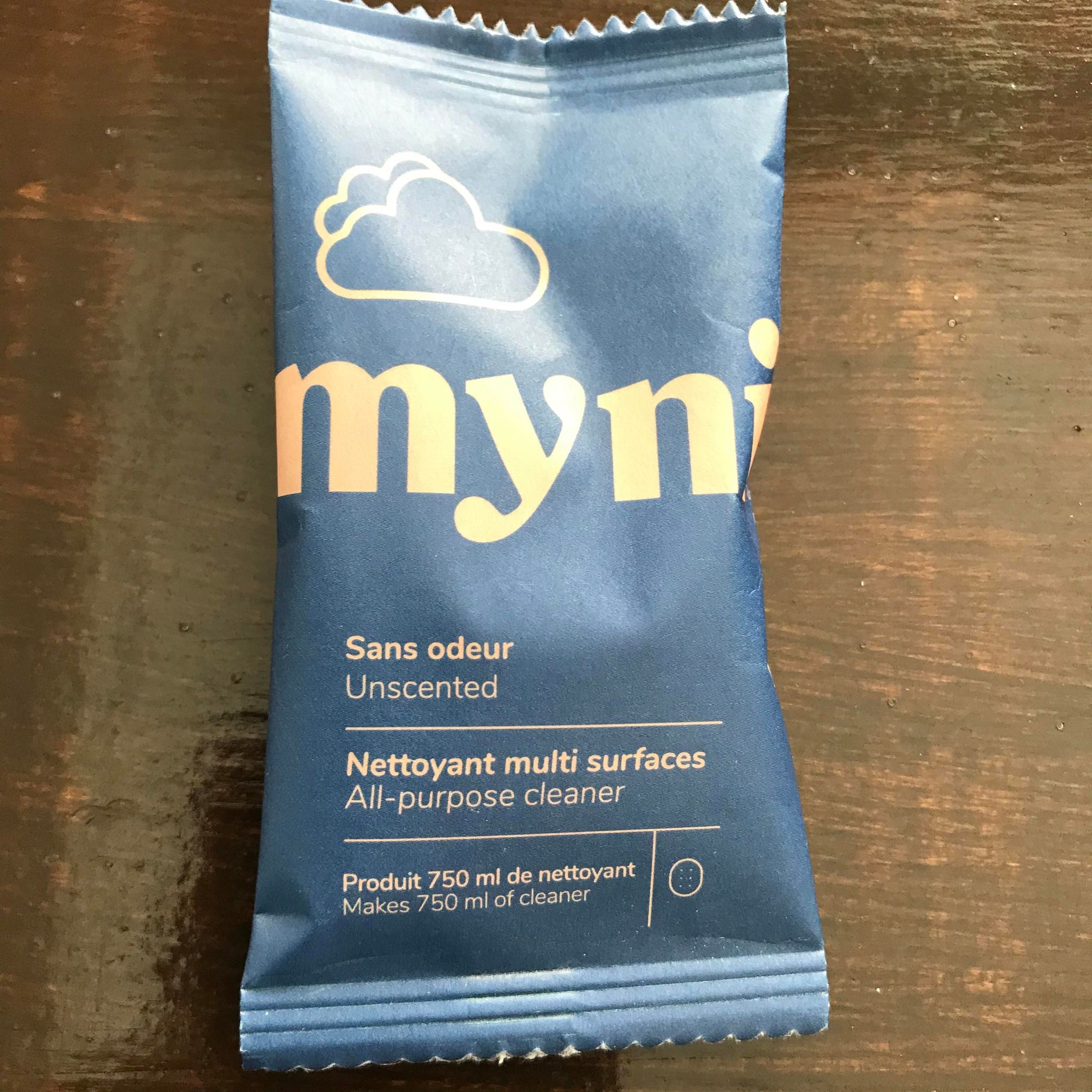 Close-up of Myni All Purpose Cleaner Tablets in clear resealable pouch, highlighting compact size and vibrant packaging