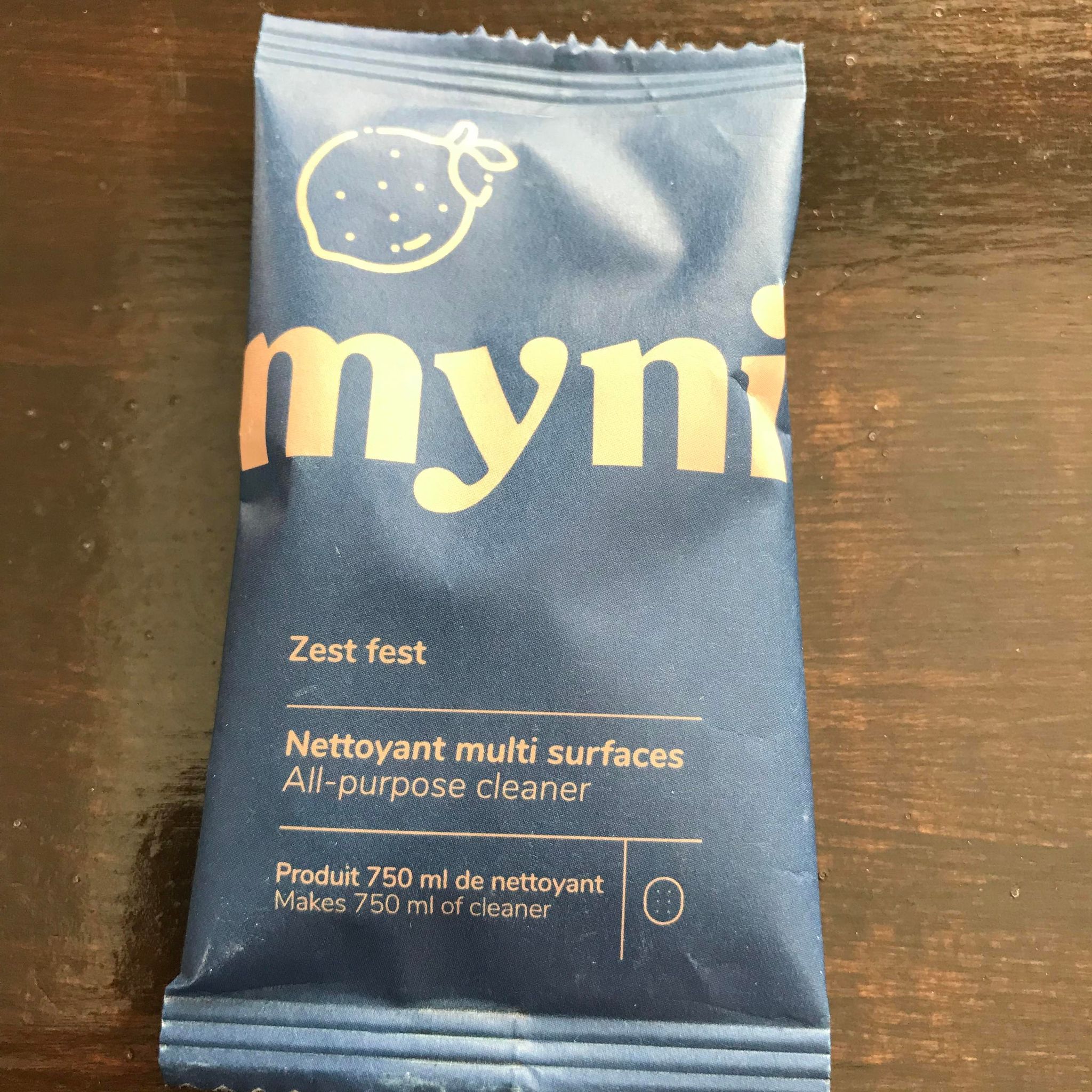 Close-up of Myni All Purpose Cleaner Tablets showing textured surface and embossed branding detail on packaging capsule
