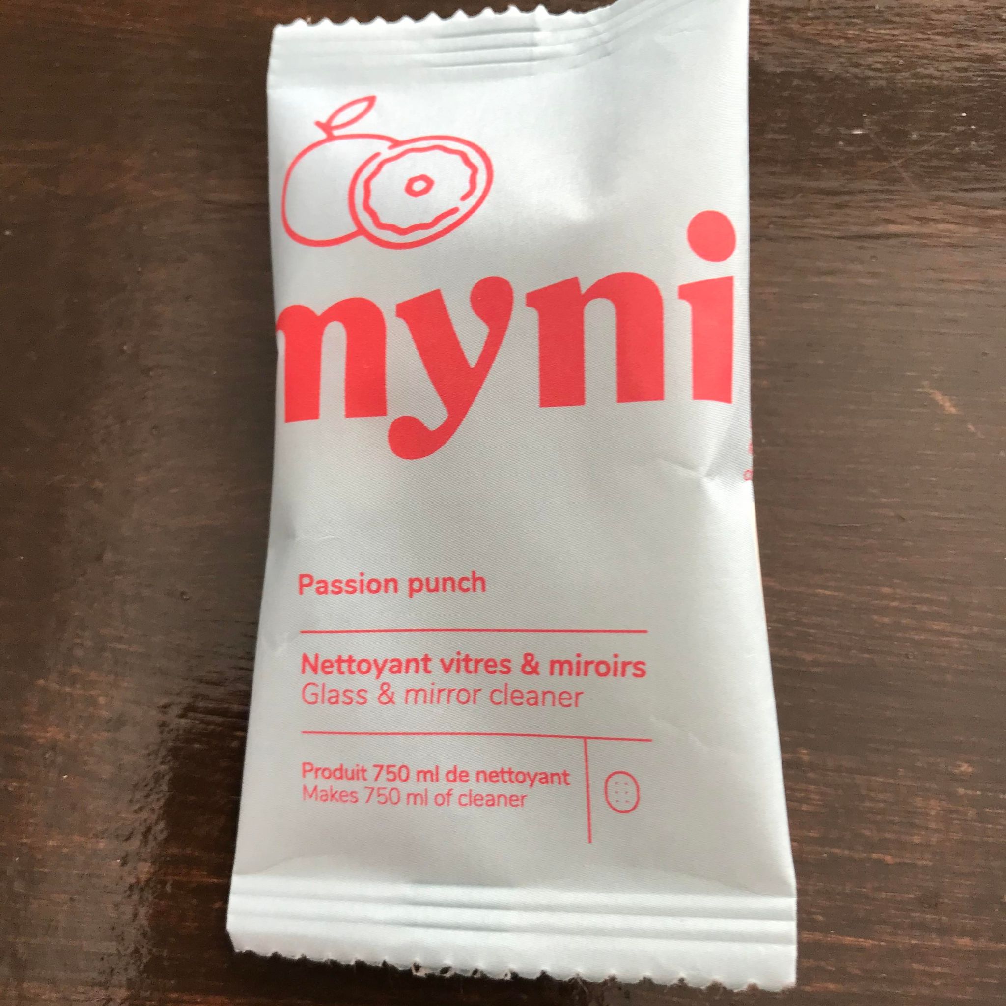 Close-up of Myni Glass & Mirror Cleaning Tablets packaging displaying detailed label with ingredient list and logo