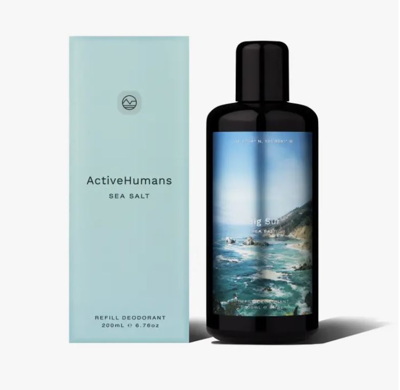 Close-up of the clear spray nozzle and mist pattern on Active Humans Sea Salt Natural Deodorant bottle against white