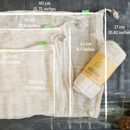 Close-up of colorful, reusable organic cotton produce bags filled with fresh vegetables, highlighting breathable mesh