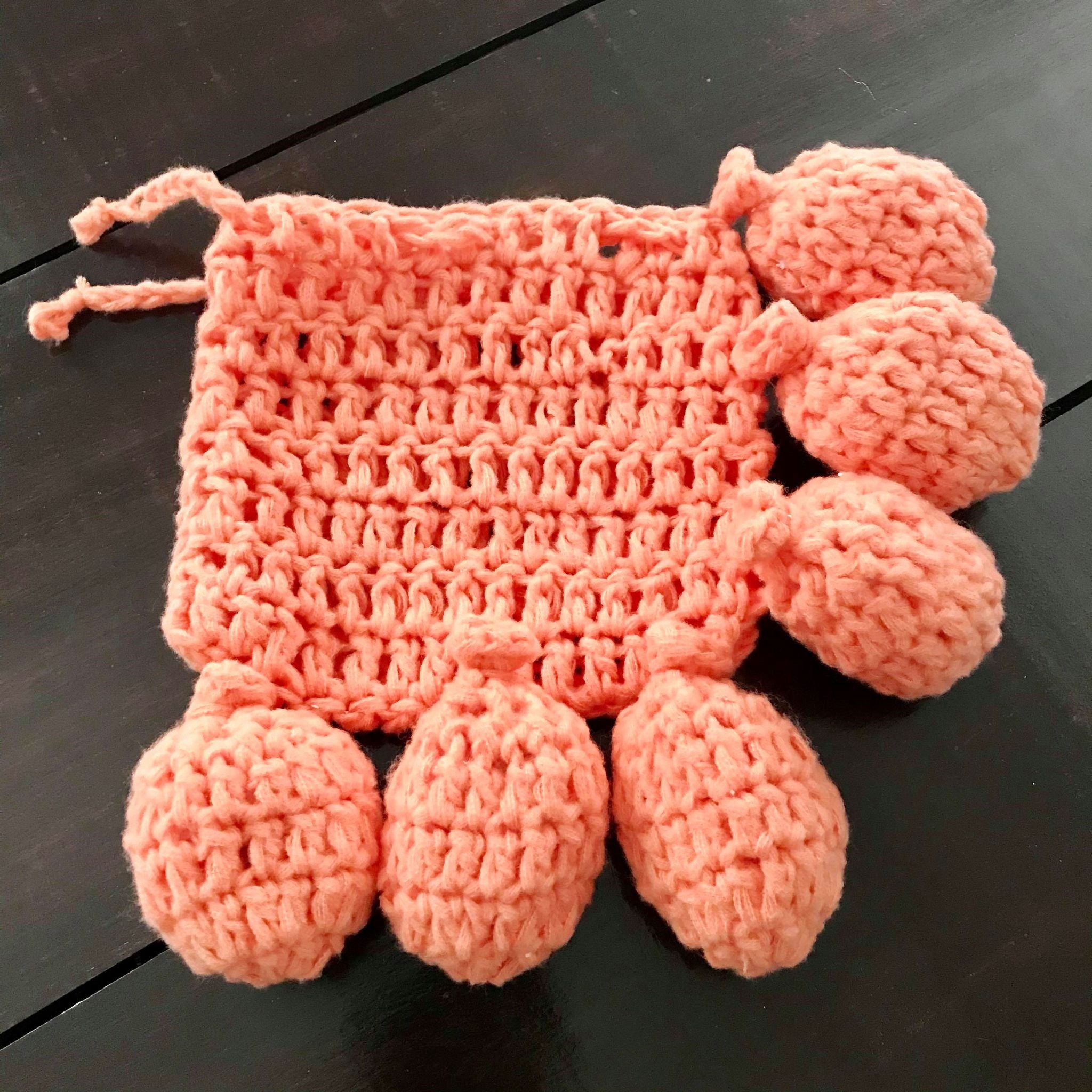 Close-up of hand-crocheted water balloons with vibrant pastel colors and textured knitted fabric showcasing their delicate