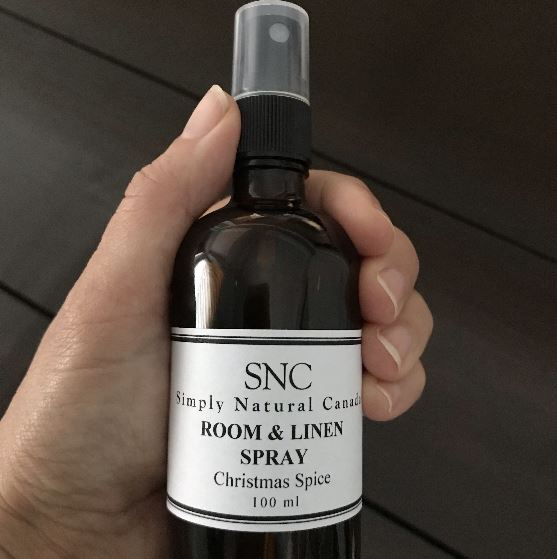 Close-up of the lavender and chamomile floral spray nozzle with textured metal cap and subtle embossed branding detail.