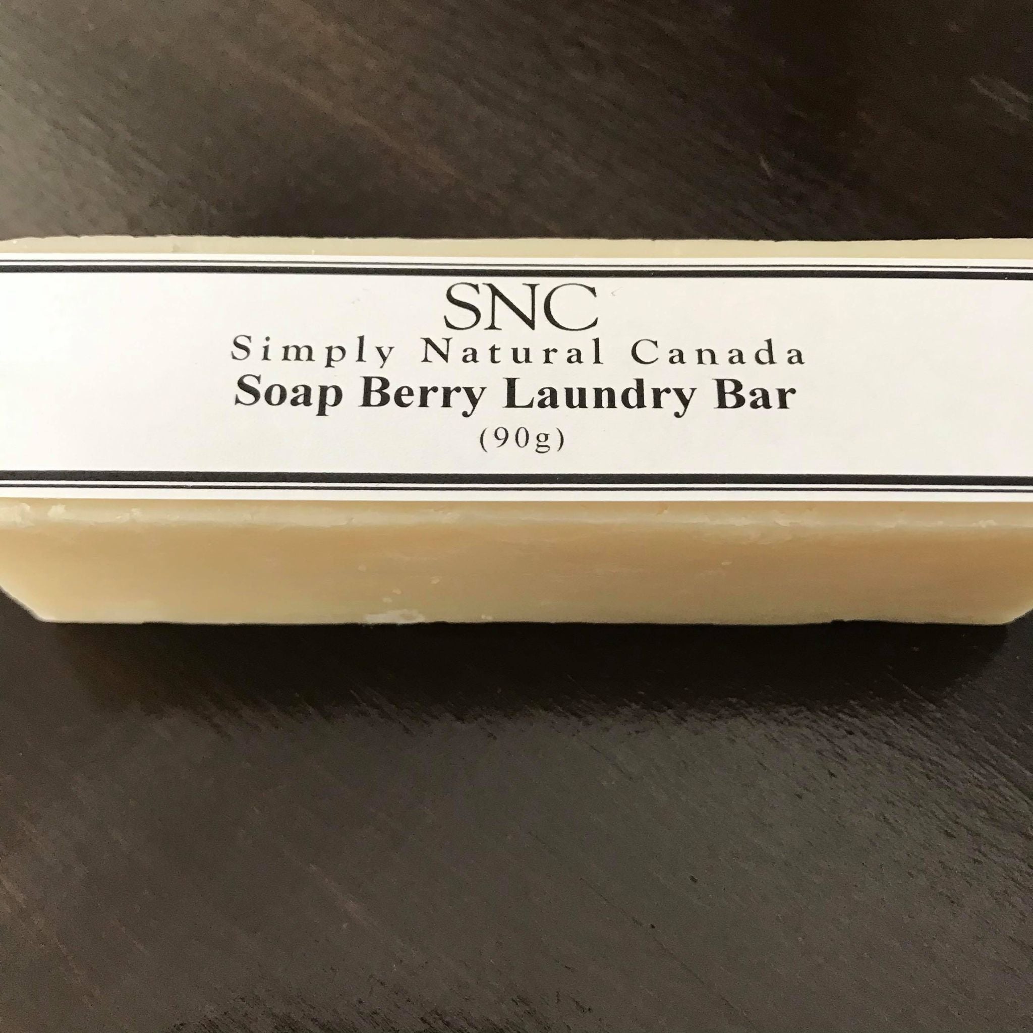 Close-up of the unwrapped Soap Berry Laundry Bar showing its smooth, cream-colored surface and natural textured top edge.