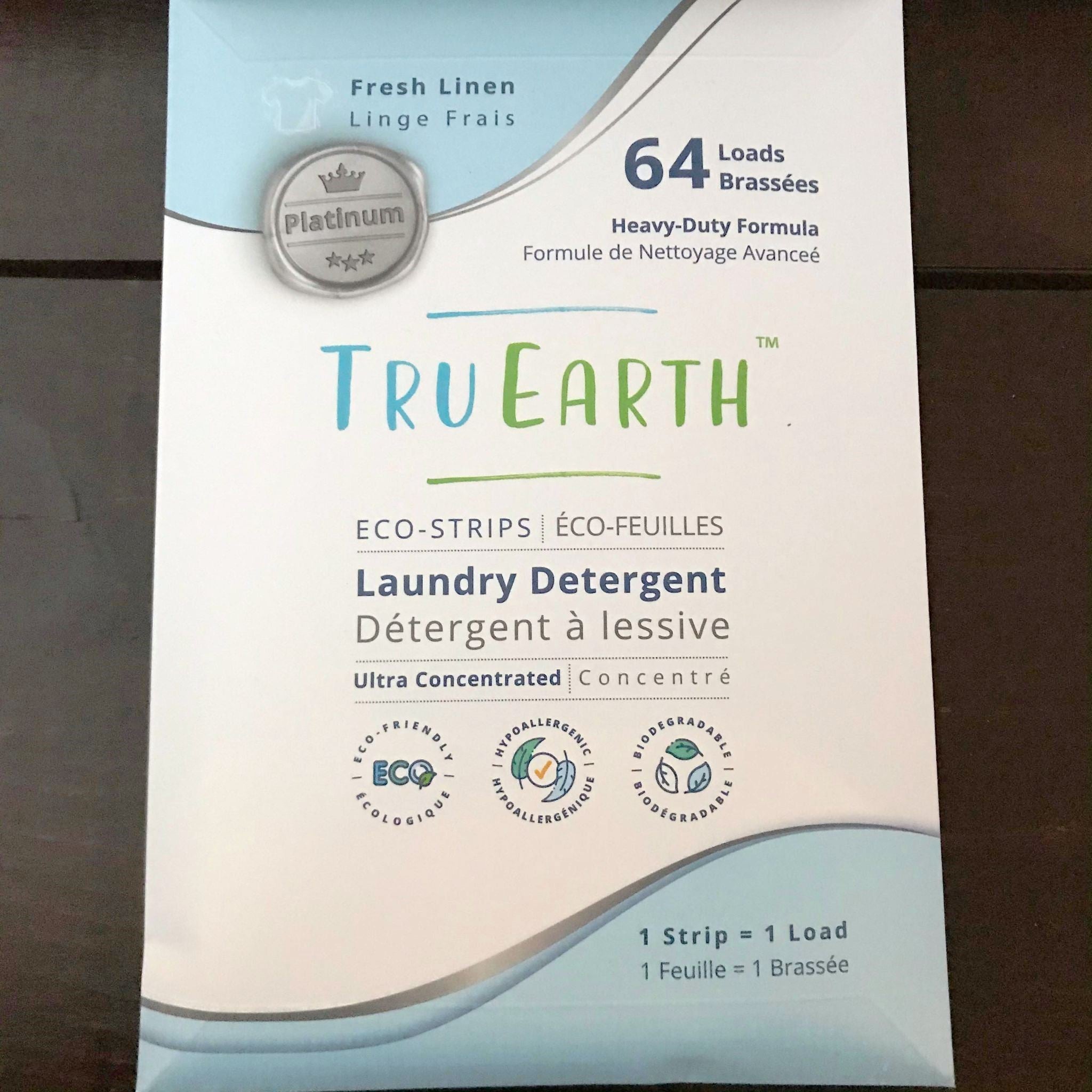 Close-up of Tru Earth Eco Strips laundry detergent package showing textured paper surface and eco-friendly branding details