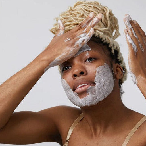 Close-up of the creamy charcoal-infused cleansing bar’s textured surface highlighting natural ingredients and soothing aroma.