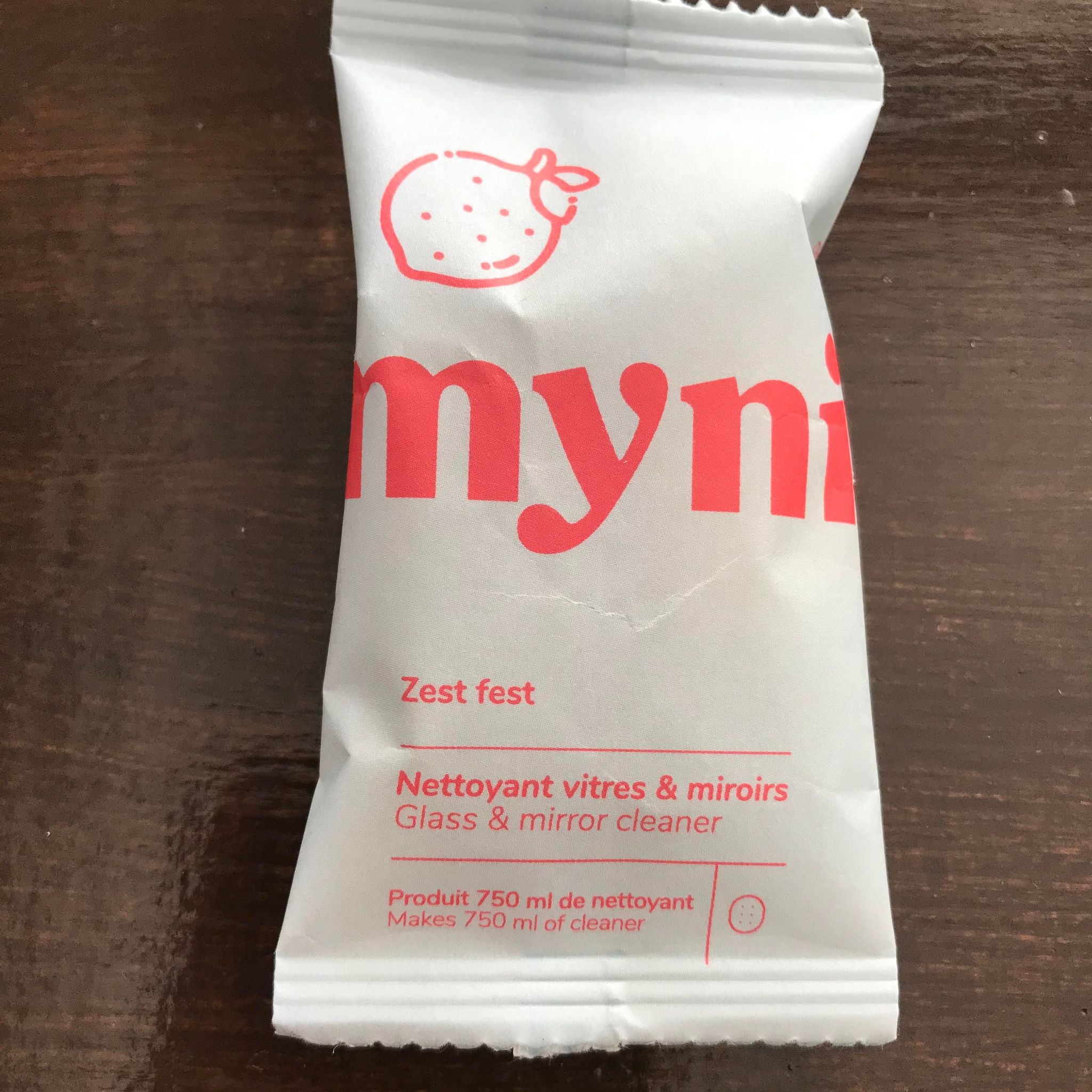 Close-up of Myni cleaning tablet packaging showing the textured label and clear branding details