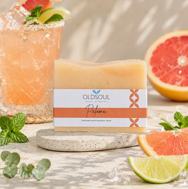 Paloma artisan soap bar by Old Soul Soap Company styled with fresh grapefruit, lime, citrus cocktail, and mint beside handcrafted Canadian natural soap