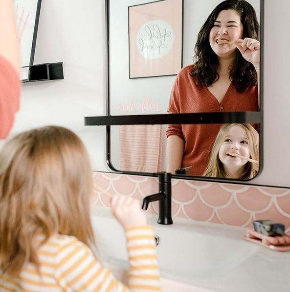 Mother and child brushing teeth together with Change Toothpaste tablets – zero waste dental care routine using plastic-free, eco-friendly oral care products.