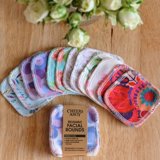 Close-up of floral-patterned fabric on facial rounds, highlighting soft texture and vibrant pink, green, and white floral