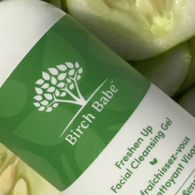 Close-up of Freshen Up Facial Cleansing Gel tube showing textured label with natural scent notes and 150ml volume in sleek