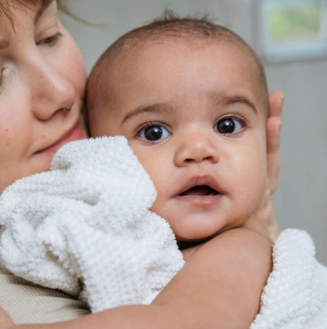 Close-up of Birch Baby Shampoo and Body Wash bottle’s textured label detailing natural ingredients and gentle formula