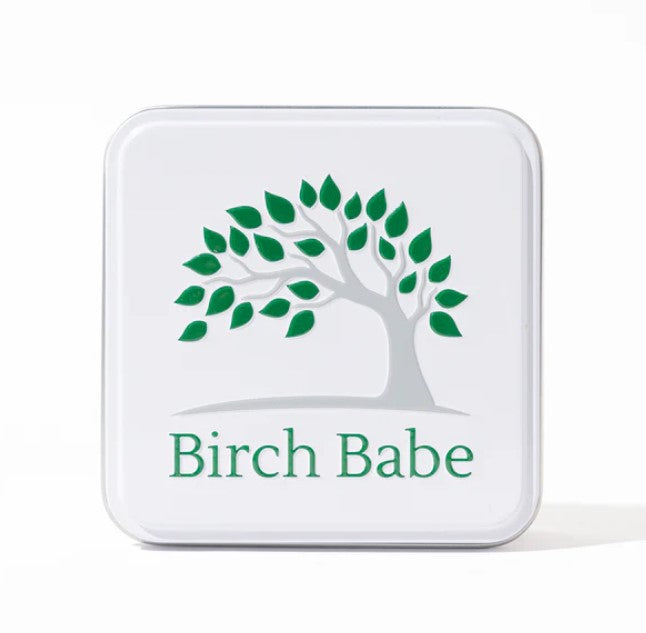 Birch Babe Reusable travel tin with matte white aluminum exterior, metal latch, and compact 4x3-inch size for shampoo and