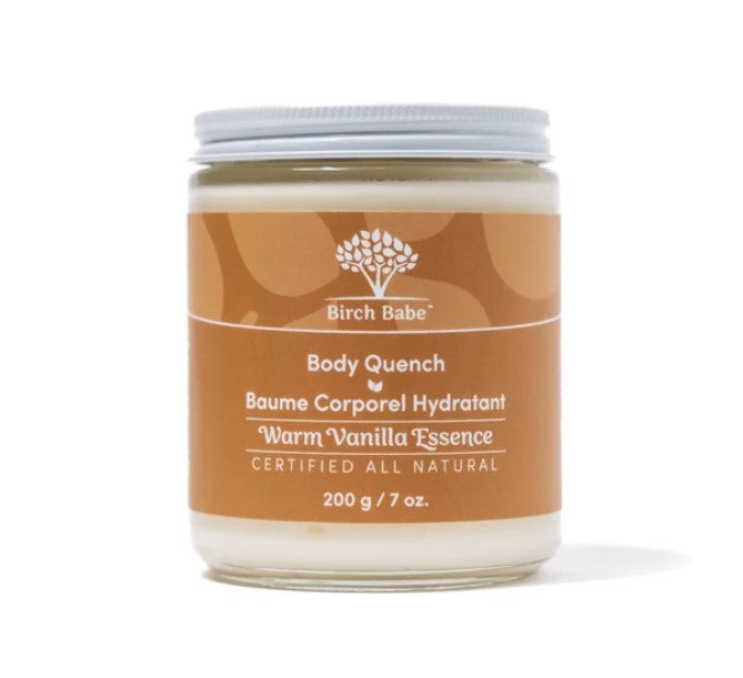 Close-up of the Body Quench Warm Vanilla Essence lotion bottle highlighting the textured label and elegant design details.