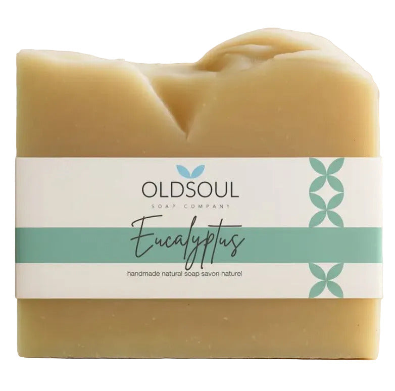 Bar of vegan essential oil cedarwood soap with 'Oldsoul Soap Company' label on a white background