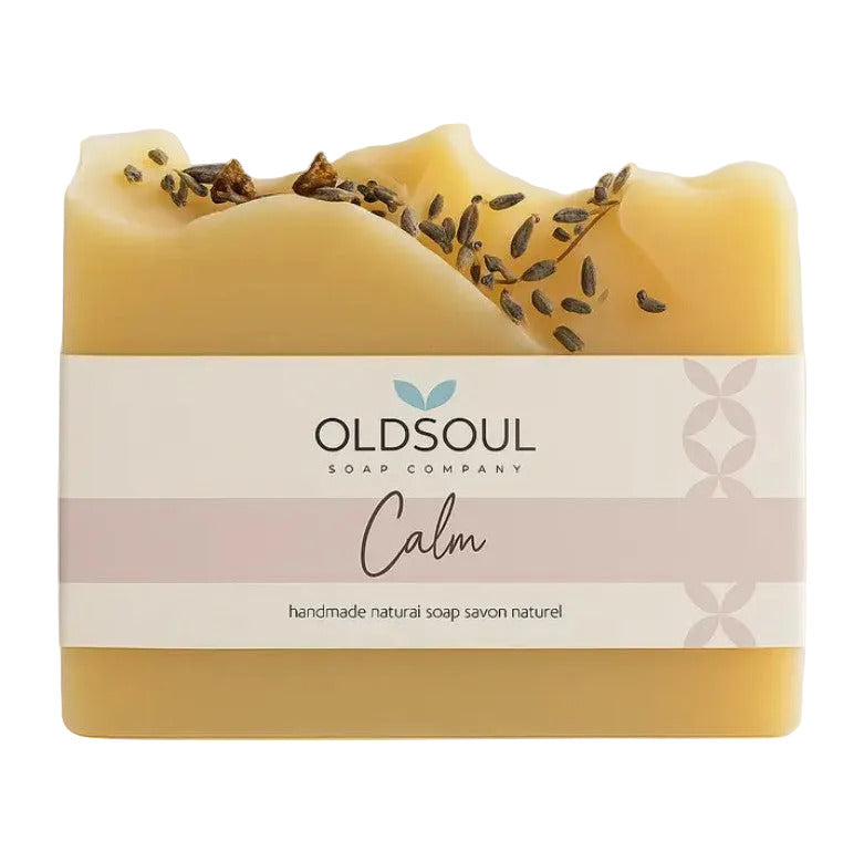 Bar of soap with lavender buds on top and 'OldSoul Soap Company' label on a white background.