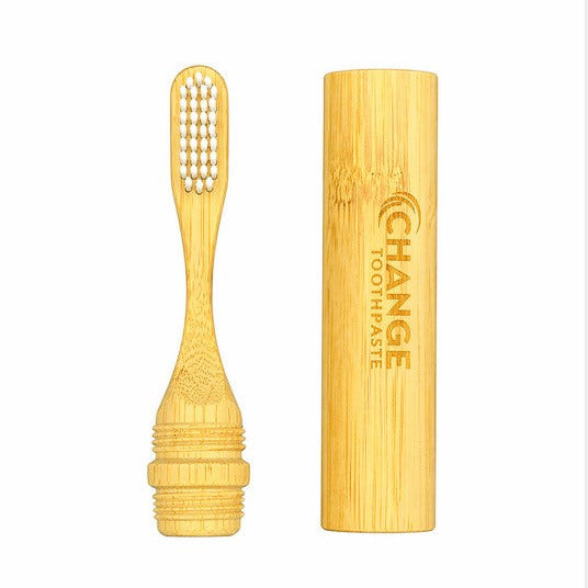 Bamboo travel toothbrush separated from reusable case by Change Toothpaste sustainable travel toothbrush set