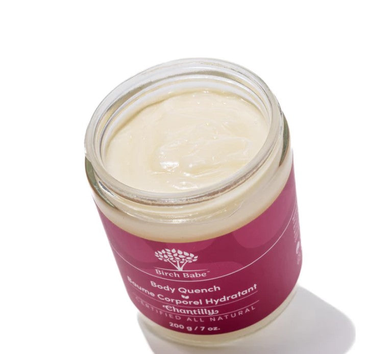 Close-up of the Body Quench - Chantilly lotion bottle neck highlighting delicate floral design and soft pastel label details.