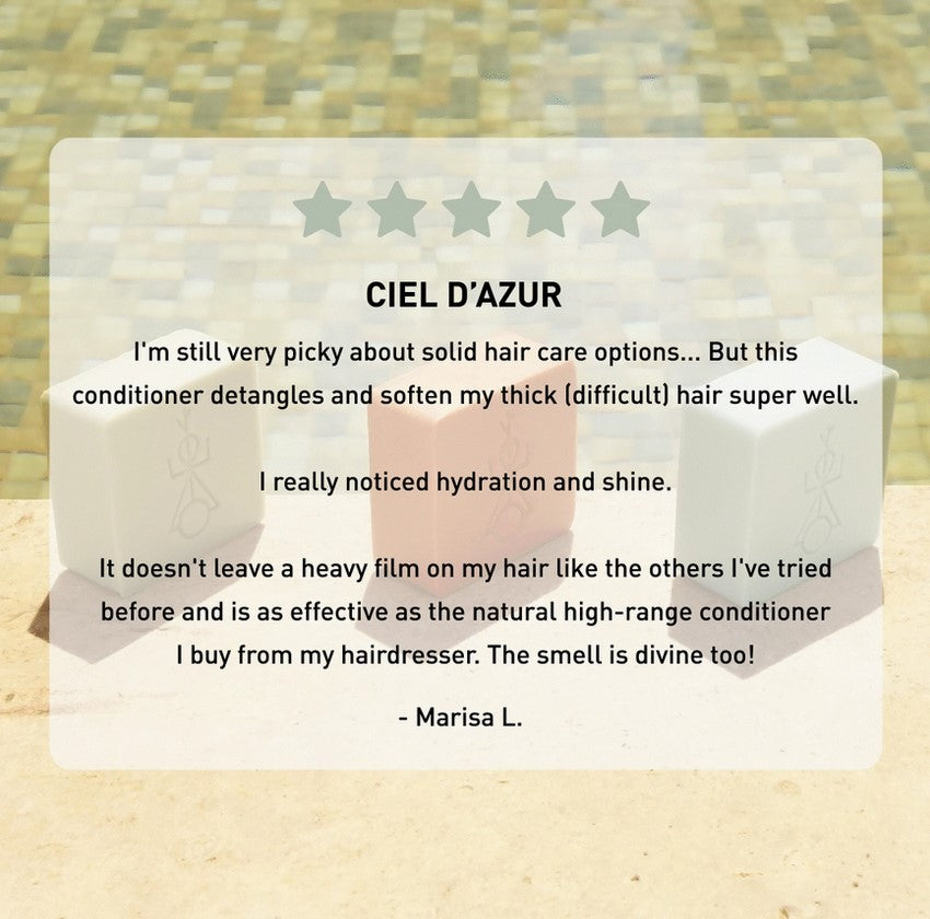 Close-up of the conditioner bar’s textured surface highlighting its smooth, creamy formula and refreshing citrus scent.