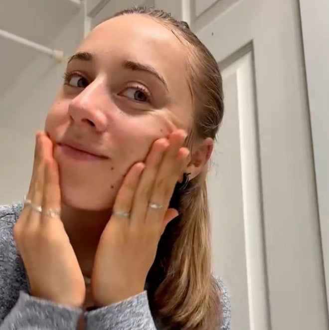 Close-up of Freshen Up Facial Cleansing Gel tube's textured, translucent formula and lavender-scented cap detail from