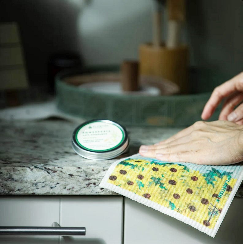 Close-up of Plantish Powerpaste soap bar displaying textured surface with visible grain and bright green color on a white