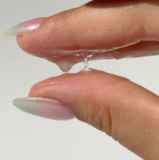 Close-up of Freshen Up Facial Cleansing Gel tube displaying vibrant scent notes and textured, squeezable packaging with