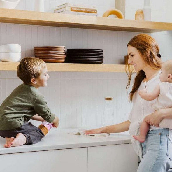 Close-up of Revolubar tablet packaging showing eco-friendly label and compact design on white background.