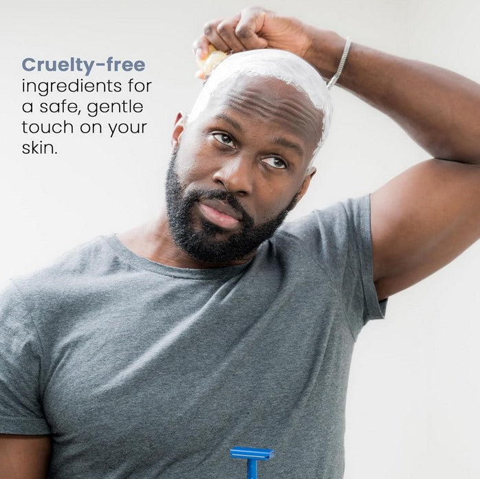 Close-up of Henson Shave Cream label highlighting natural ingredients and soothing scent on sleek tube packaging