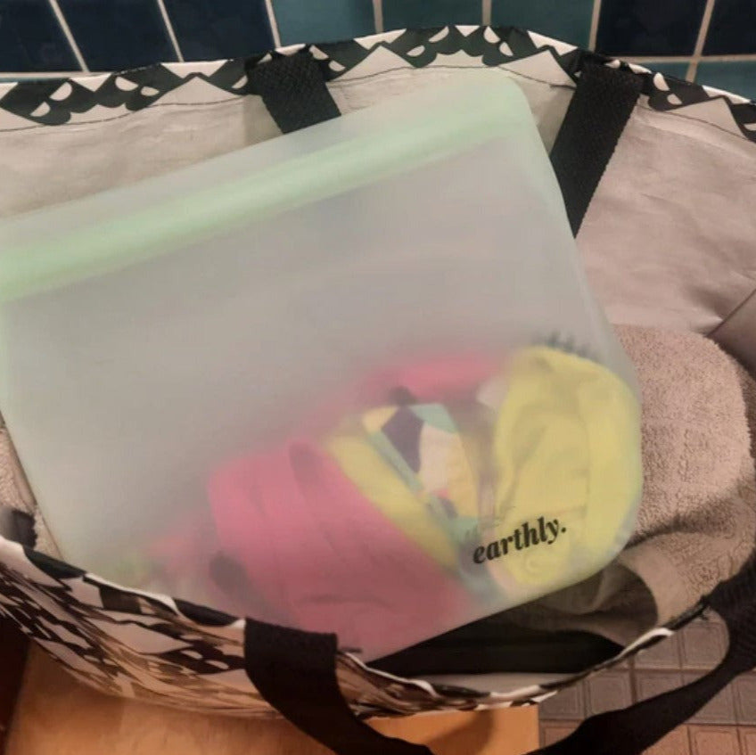 Close-up of colorful silicone bags featuring textured seams and reinforced edges for durable storage of organic, farm-raised