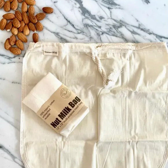 Close-up of the breathable mesh texture and reinforced drawstring closure of the organic cotton nut milk bag from an