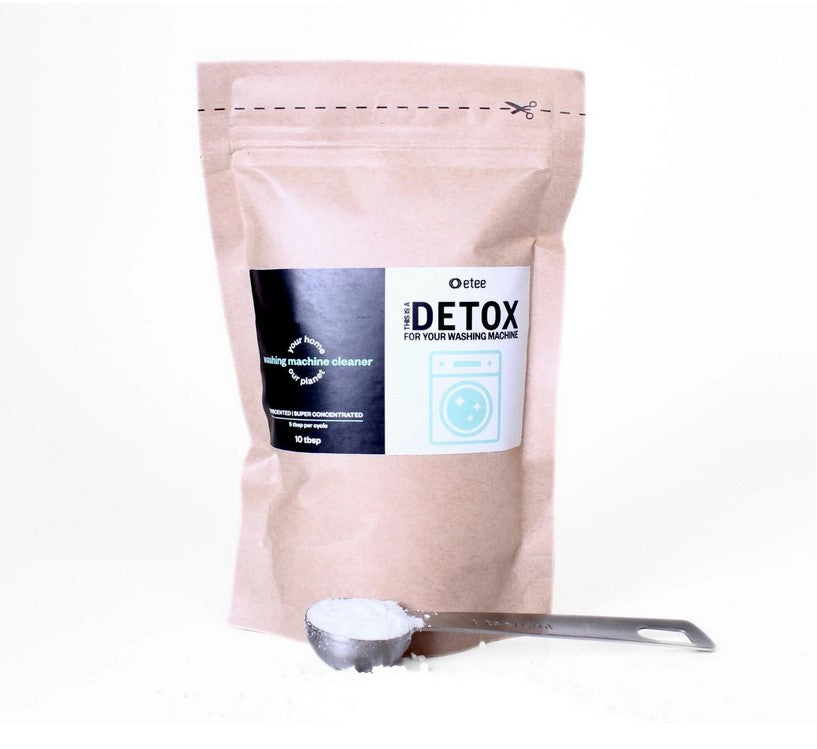 Etee Washing Machine Cleaner powder in white, granular texture with blue scoop, labeled as laundry detox and eco laundry