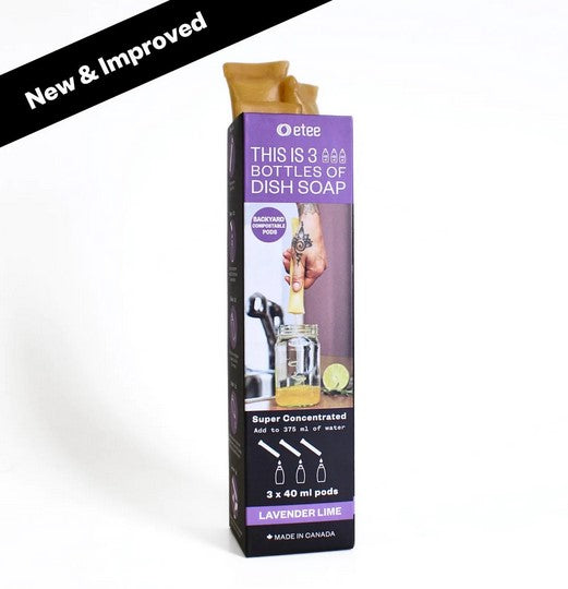 Close-up of the clear, plastic dish soap concentrate bottle showing blue liquid and textured label detailing ingredients