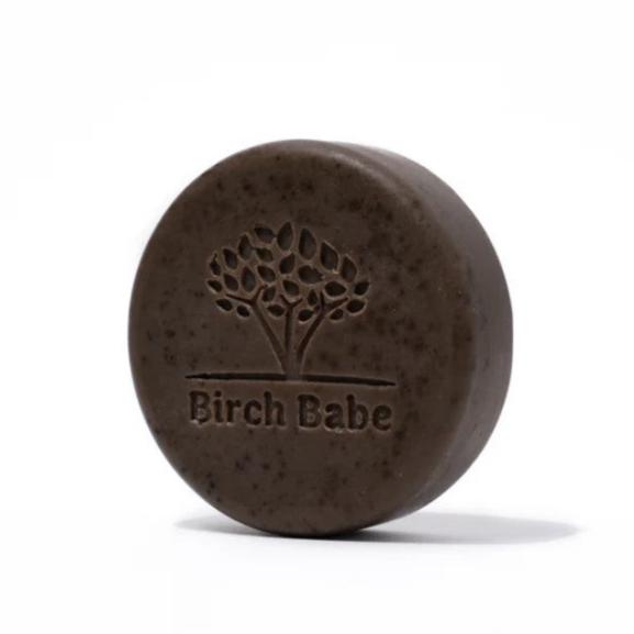Hand-crafted coffee exfoliating body bar with natural, organic ingredients by Birch Babe in a textured, dark brown soap form