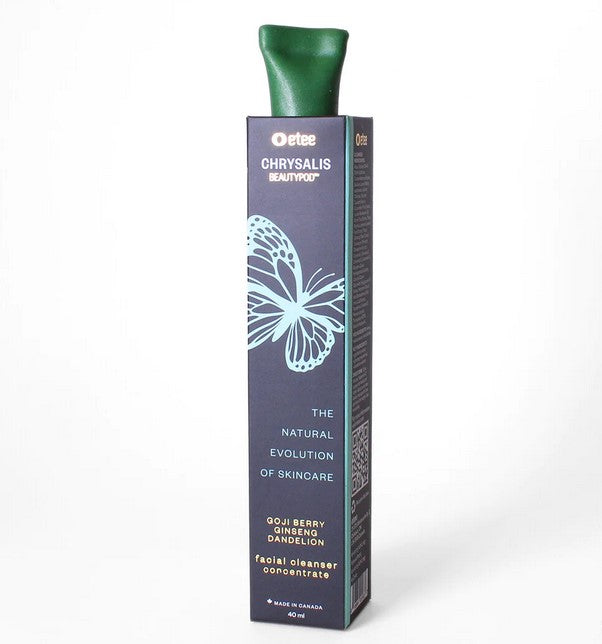 Close-up of the Facial Cleanser Concentrate’s frosted glass bottle showing tactile texture and sleek, minimalist label