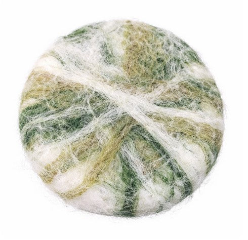 Close-up of felted 'winter greens' cedar sage soap’s textured surface on a white background