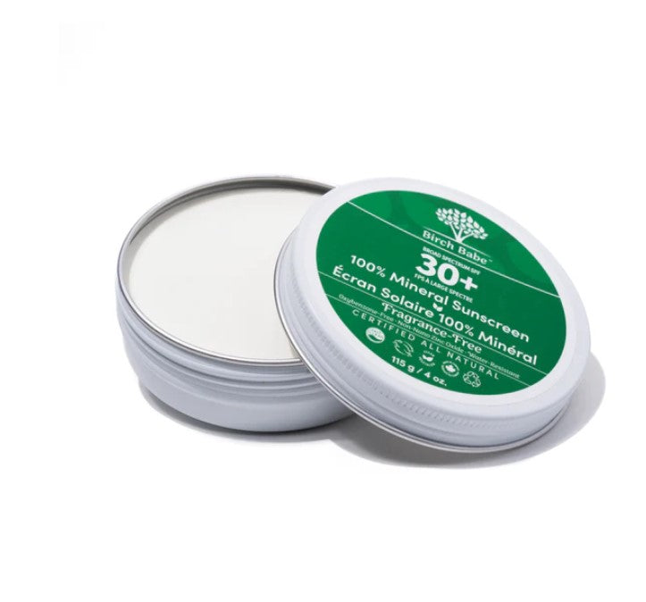Birch Babe Mineral Sunscreen tube's front label detail highlighting SPF and natural ingredients, with a soft focus background