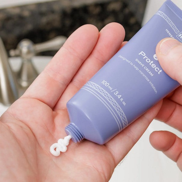Close-up of Henson Shave Cream tube showing textured cream with fresh citrus scent and detailed ingredient label