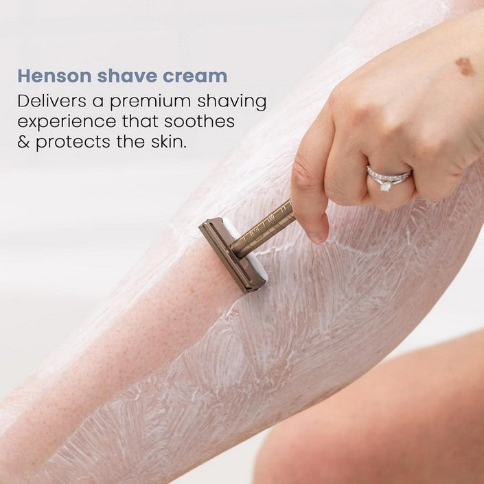 Close-up of Henson Shave Cream tube showing detailed ingredients list and textured blue and white packaging label.