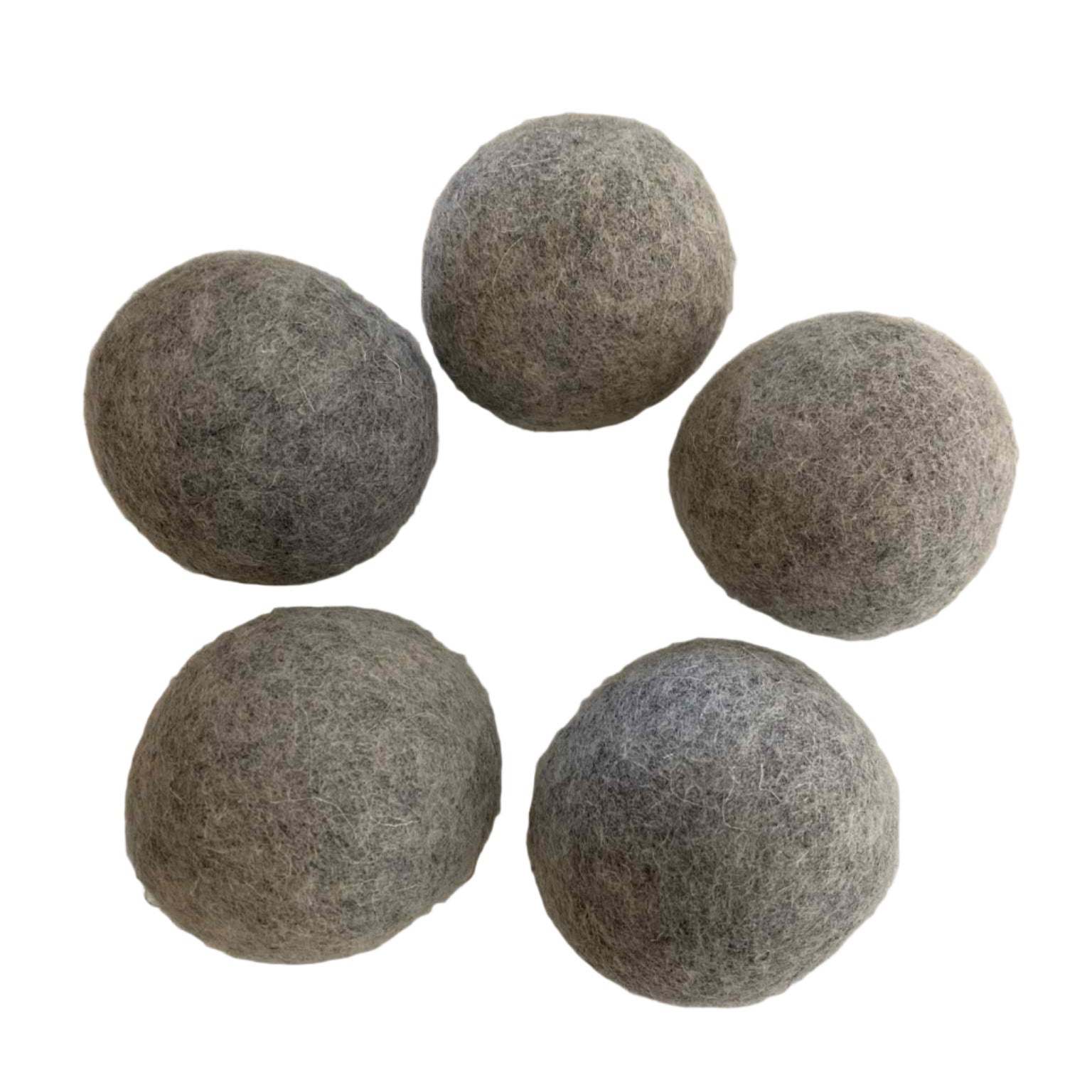 Close-up of Earthly Wool Dryer Balls showing their textured, natural wool surface and tightly woven fibers for effective