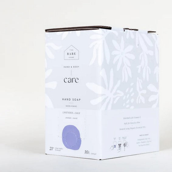 Close-up of lavender and sage botanical illustrations on the soap label with textured creamy soap in background