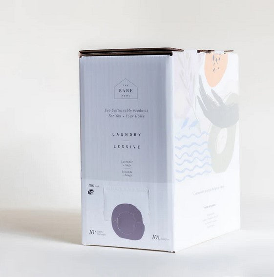 Close-up of lavender and sage scent notes on detergent label with textured fabric background and natural color palette.