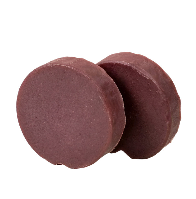 Close-up of a Leaf Shave Soap Bar showing textured surface with green and tan swirls and a slightly uneven, handcrafted